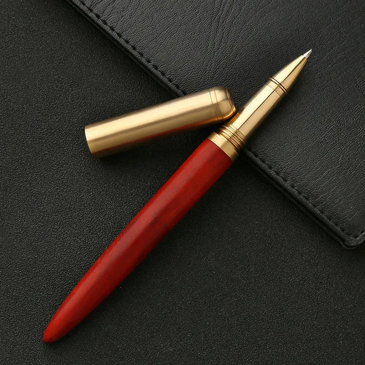 Brass and solid wood signature pen showing wood grain and metal details