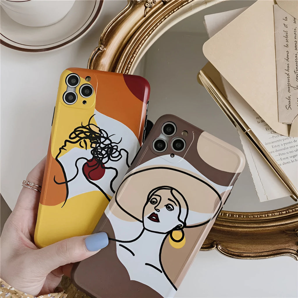 Orange yellow cartoon line art silicone protective case for iPhone on a phone.