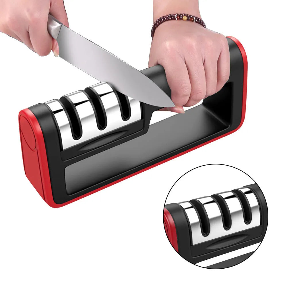 Black and red three-stage manual knife sharpener with rubber feet on base