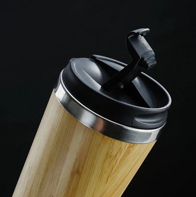 Bamboo insulated travel coffee cup with lid, showing anti-slip base pad, 420ml capacity.
