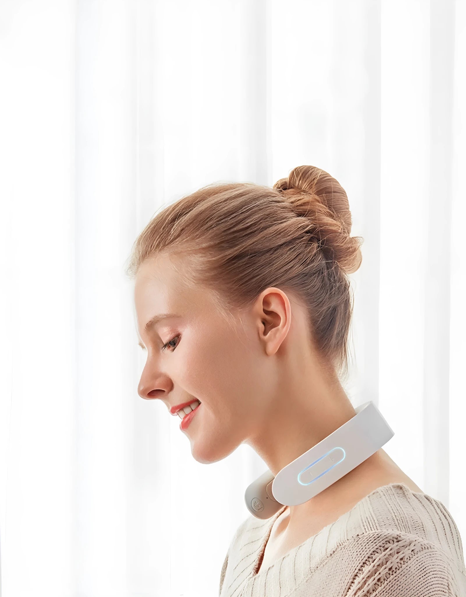 White electric acupressure massager for back neck and shoulders with control buttons.