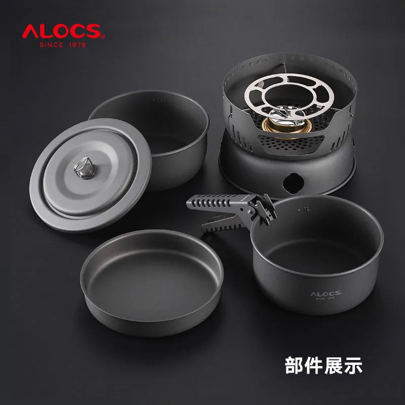 Alocs CW-K26 aluminium non-stick outdoor camping pot set stacked on a wooden table.