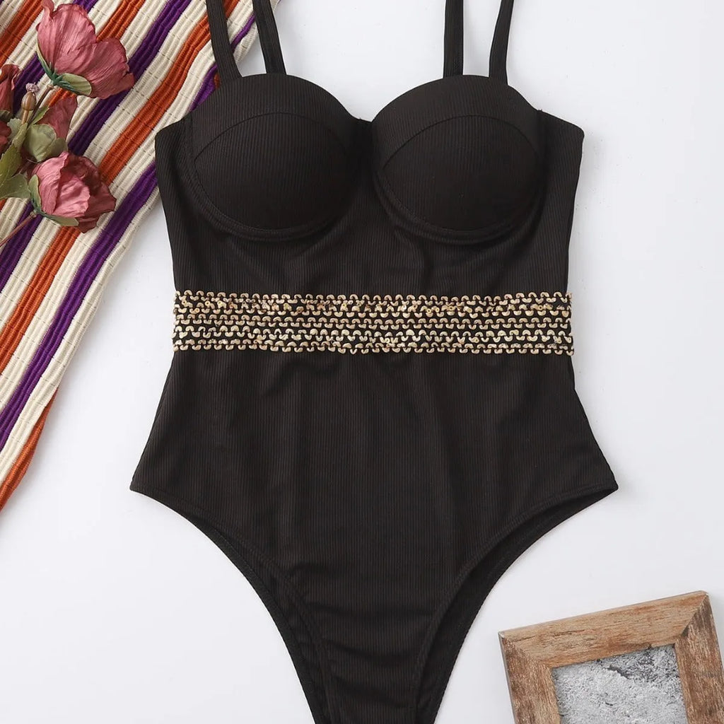 Black one-piece women's swimsuit bikini with adjustable shoulder straps on a white background.