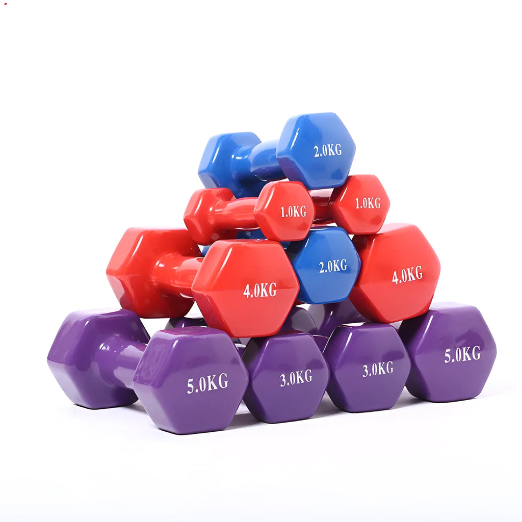 Brightly coloured plastic fitness dumbbells on a floor, showing glossy surface and multiple weight options.