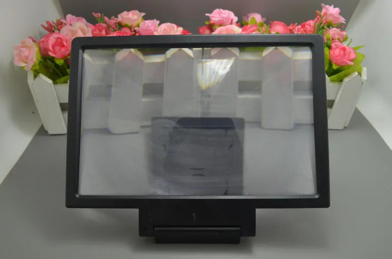 Black screen amplifier magnifier placed against mobile phone showing enlarged display