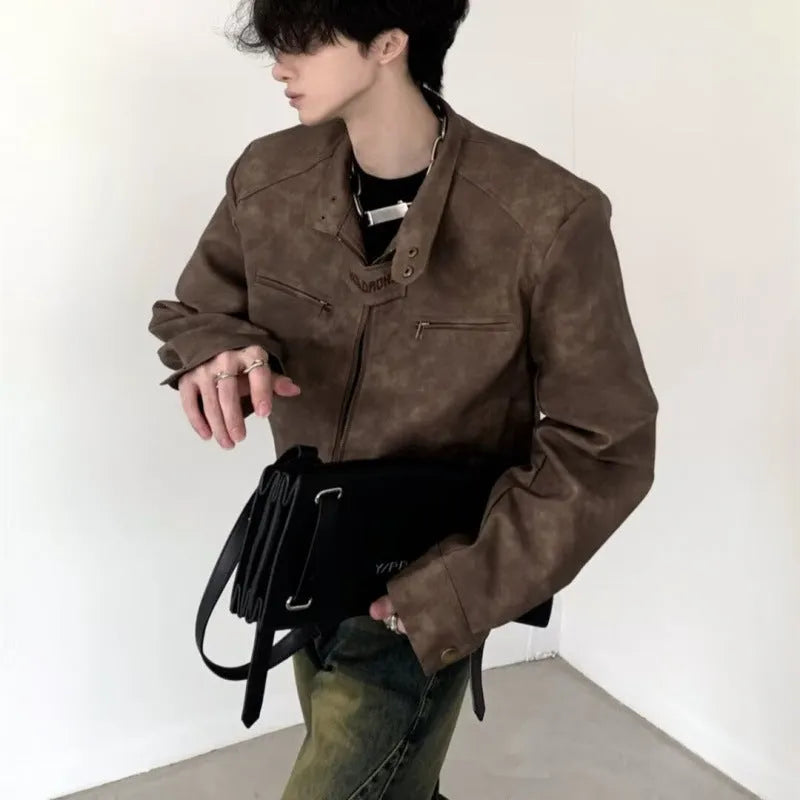Men's retro brown PU leather short coat with tight fit and long sleeves on a plain background