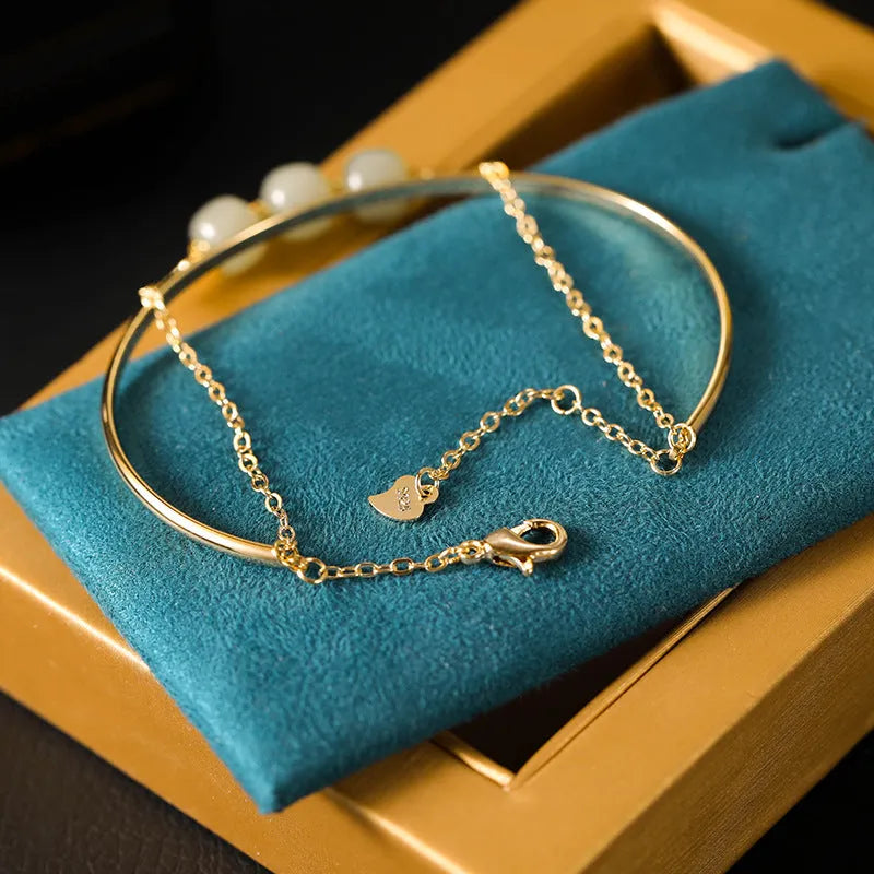 Women's Hetian jade lucky beads bracelet with gold inlay, shown in single, double, and three bead version styles.