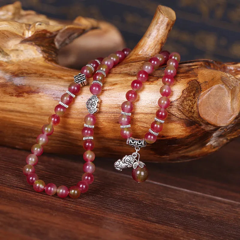 Handmade natural watermelon crystal Chinese knot bracelet in geometric elephant style.