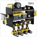 Wall-mounted carbon steel three-layer tool rack holding electric drills and screwdrivers in a garage