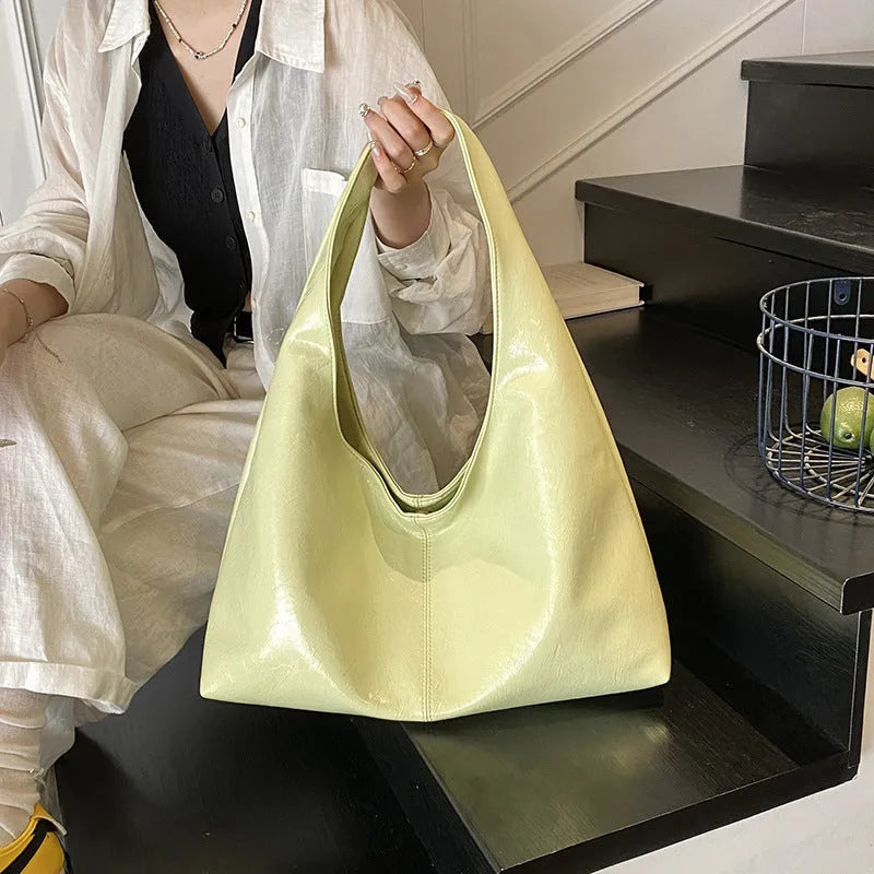 One shoulder tote bag in cream yellow with square vertical shape, outer slit pocket, internal phone bag, PU outer and polyester lining