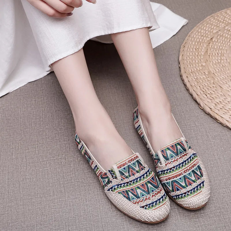 Women's ethnic style cloth shoes with flat heel, colour stitching, and shallow mouth opening