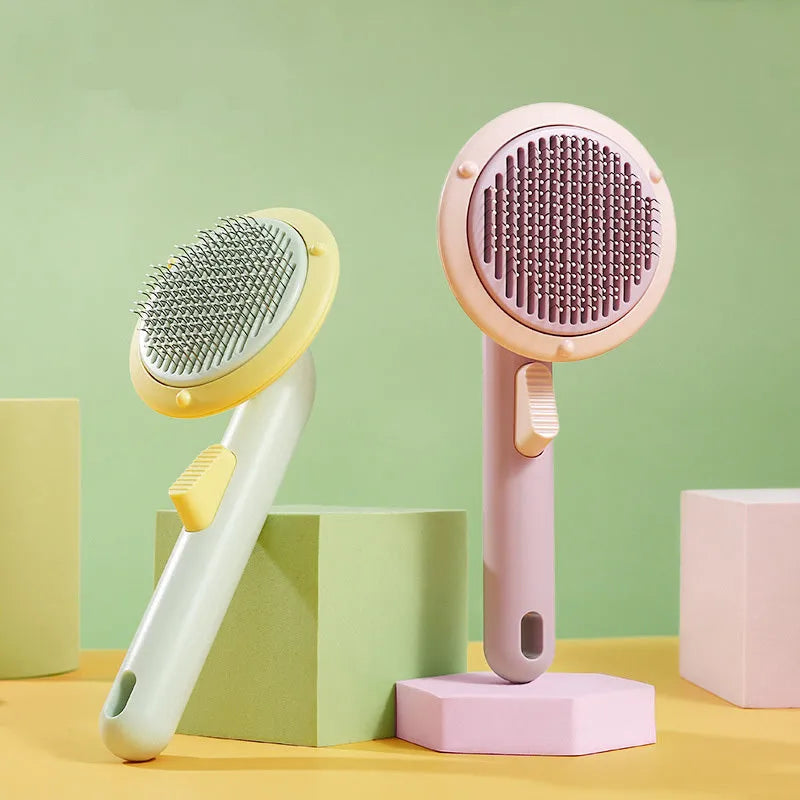 Hand-held pet grooming brush with stainless steel needles in pumpkin colour design