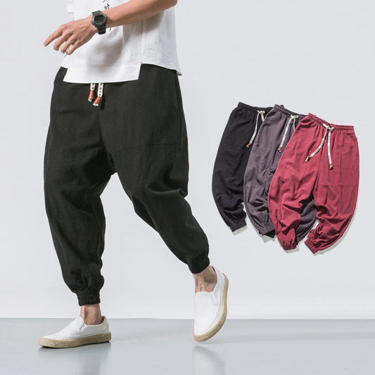 Men's cotton jogger pants with drawstring waist, side pockets, and tapered legs in various colors