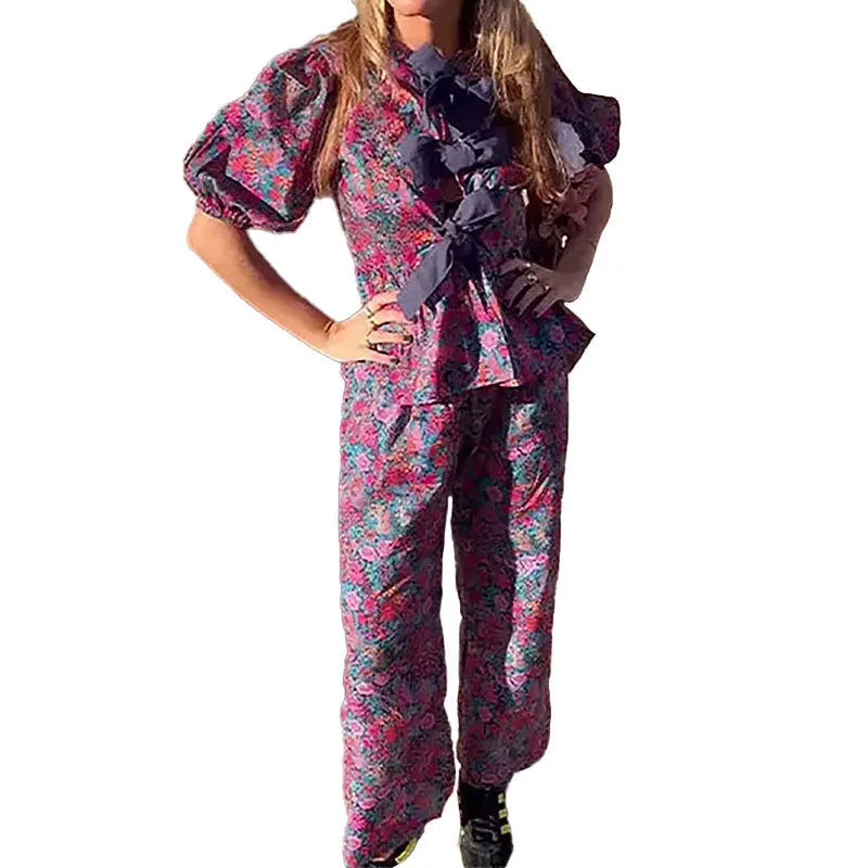 Floral print trousers suit with tie-neck puff sleeve blouse and matching trousers