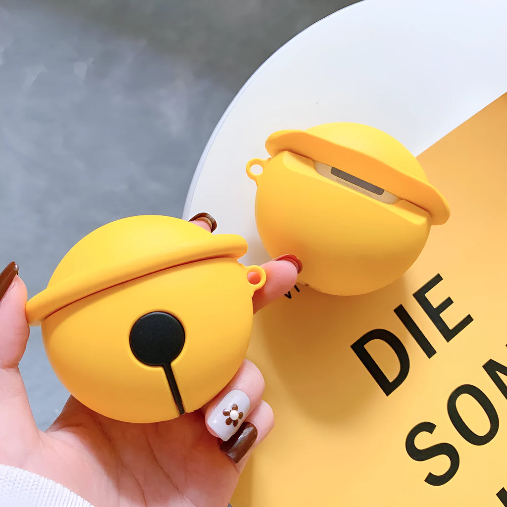 Yellow silicone protective case for AirPods 1 and 2 with a small bell charm attached.