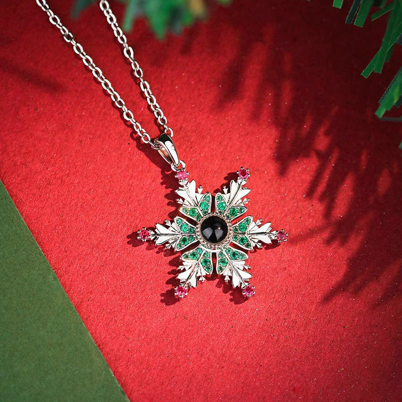 Sparkling copper snowflake projection pendant necklace with delicate chain, creating a magical winter wonderland display