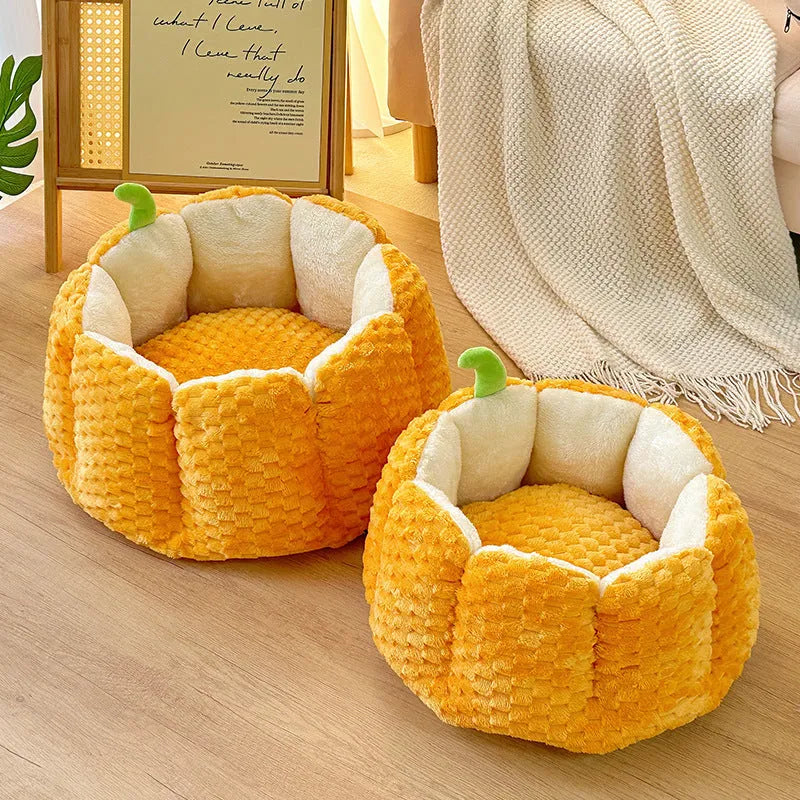 Pumpkin-shaped cat bed with raised rim showing interior cotton filling