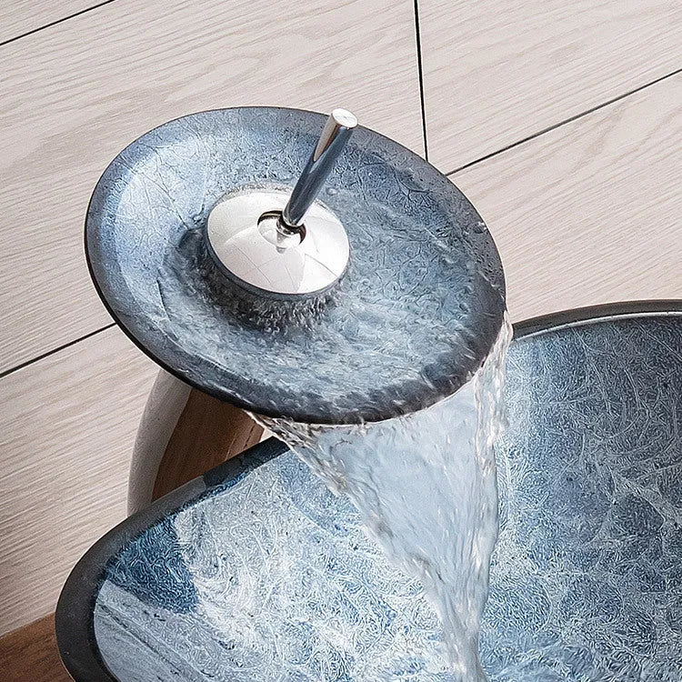 Modern blue-grey tempered glass table basin with a simple design for bathroom vanity units.