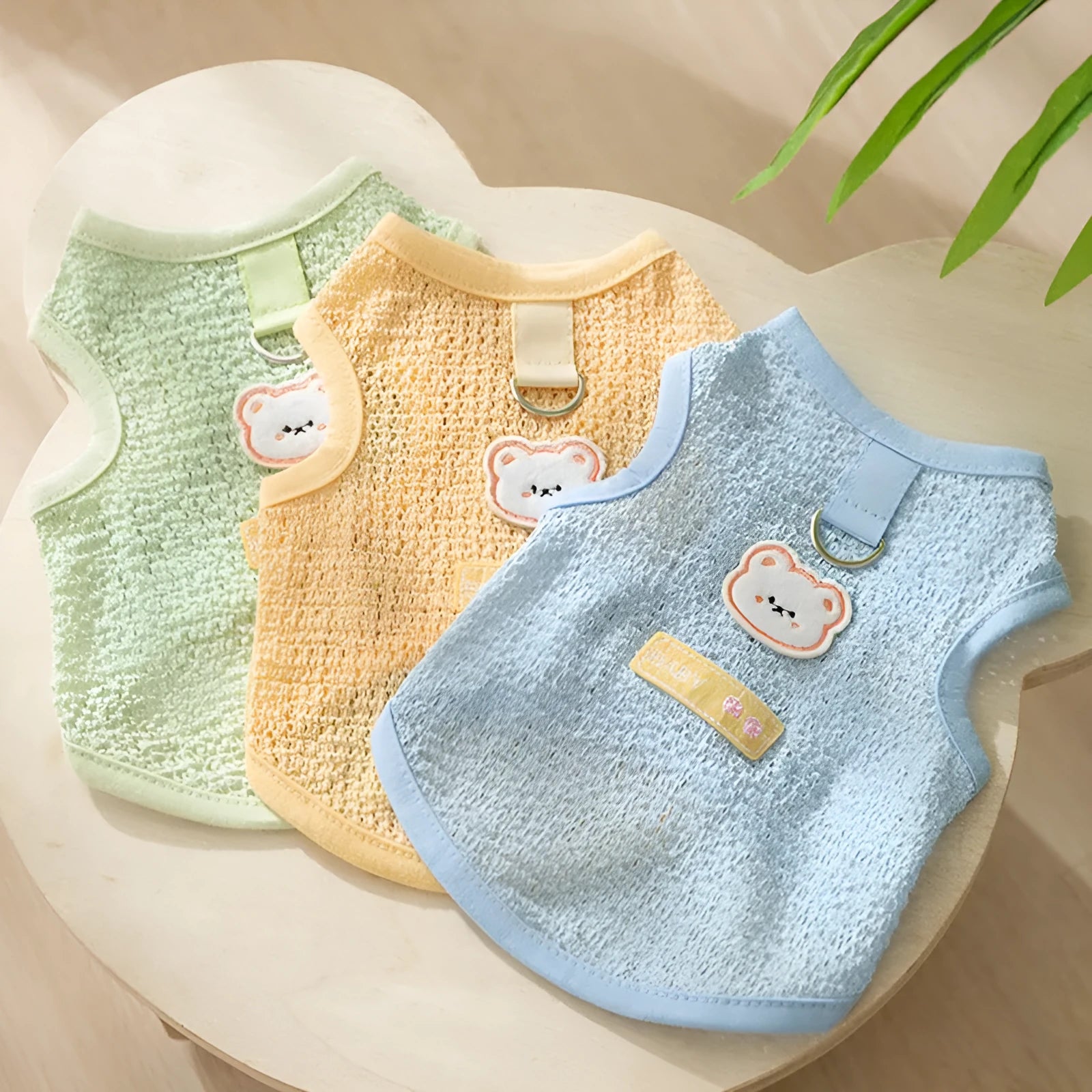 Bear patch cat clothes in hollowed-out knitted fabric showing breathable pattern