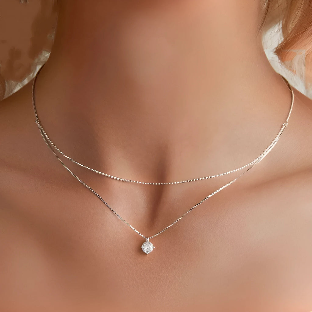 Double-layer sterling silver necklace with pearl chain and silver pendant