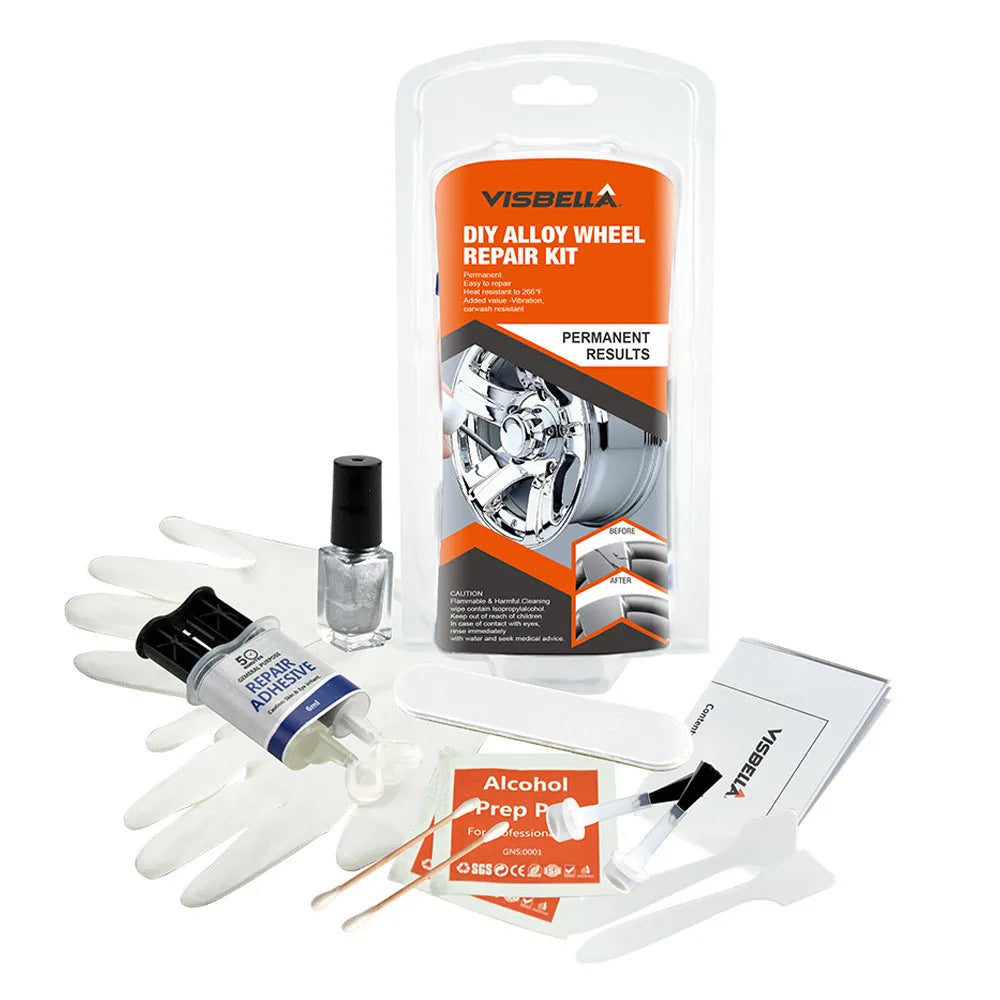 Alloy wheel repair kit with glue, paint, sanding file, gloves, spatulas and brushes on workbench