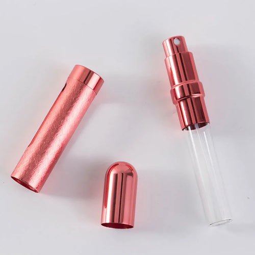 Slender silver aluminium travel perfume bottle with glass liner, shown next to a ruler indicating 115mm length.