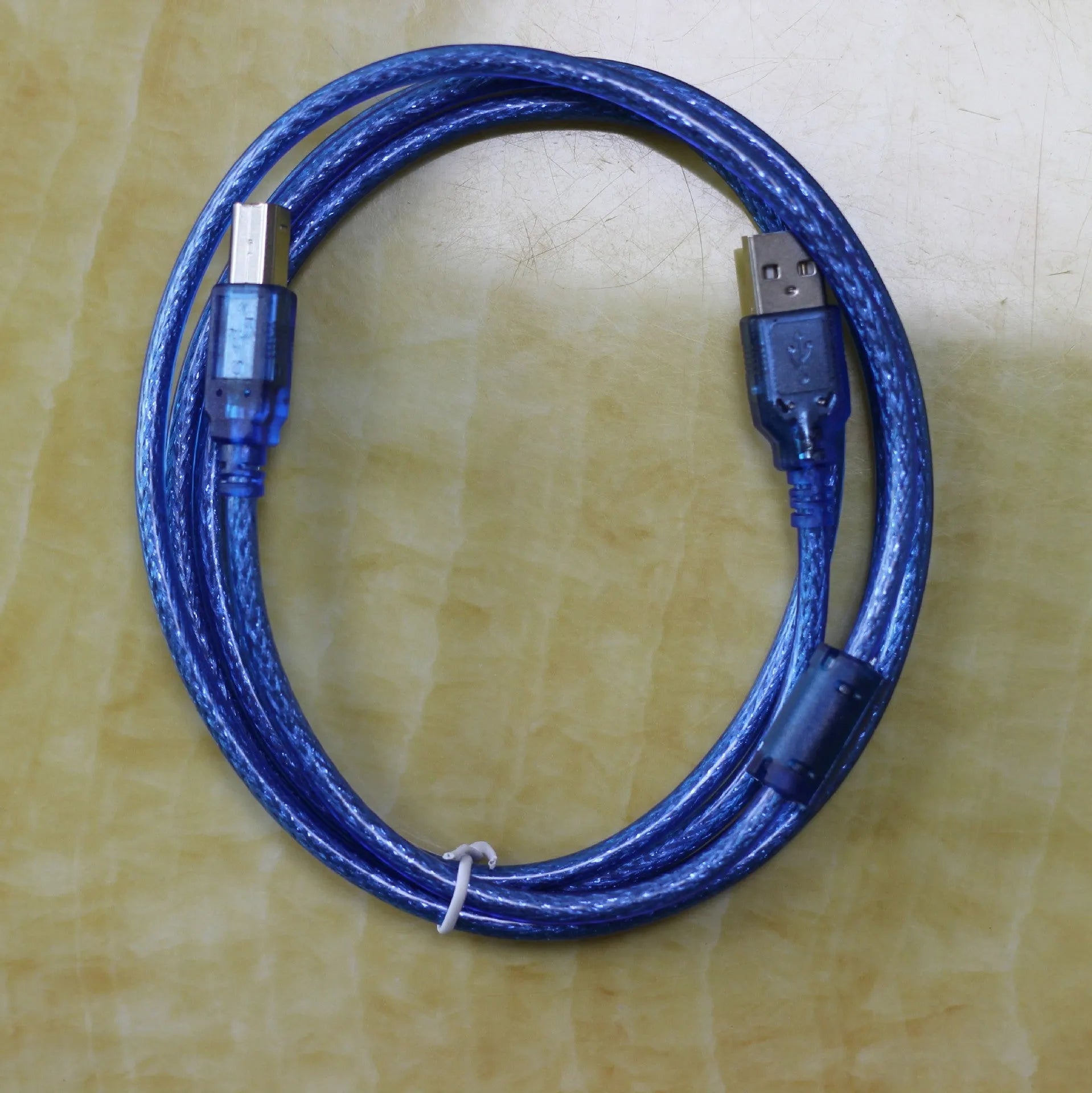Black USB OTG cable with Mini USB and TYPE-C connectors on white background