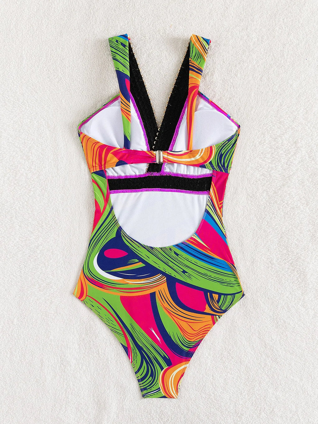 Women's deep V-neck one-piece swimsuit with spaghetti straps in a printed pattern