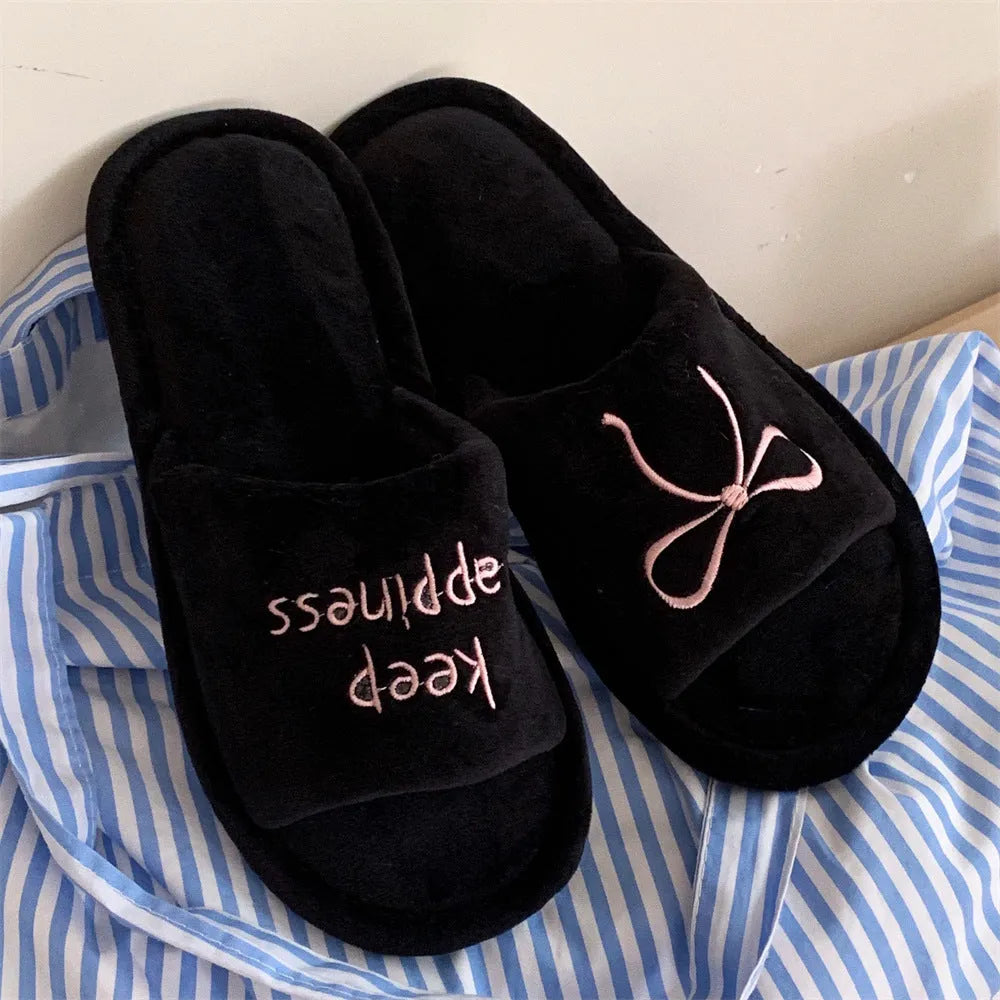 Ladies cotton slippers with suede upper, artificial wool lining, flat non-slip PVC sole, bow and letter detail, beige yellow pink black