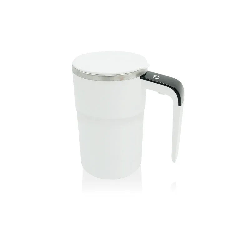 Black and white USB rechargeable electric stirring mug with LCD screen showing temperature, next to its magnetic stirrer.