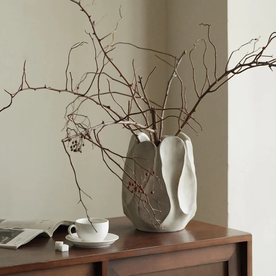 Irregular ceramic art vase in magnesium clay material showing textured finish and distinctive handmade shape