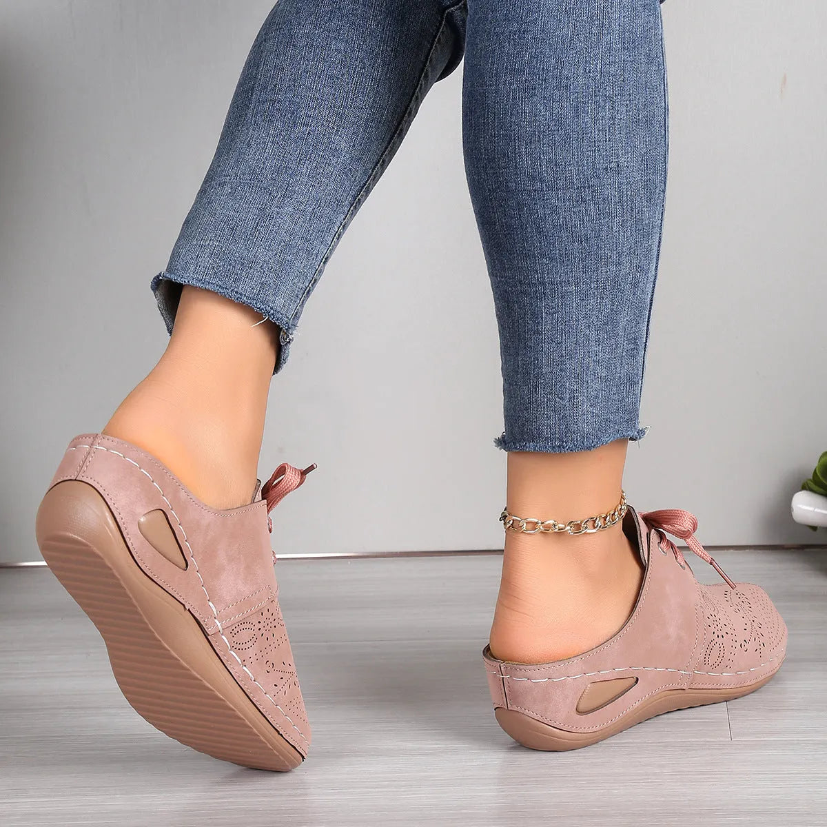 Women's suede lace-up wedge slippers in light grey with a hollow out design and rubber sole.