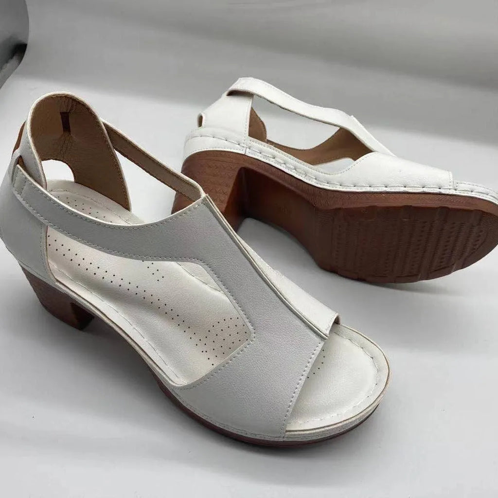 Women's beige peep toe wedge sandals with a buckle strap and low heel