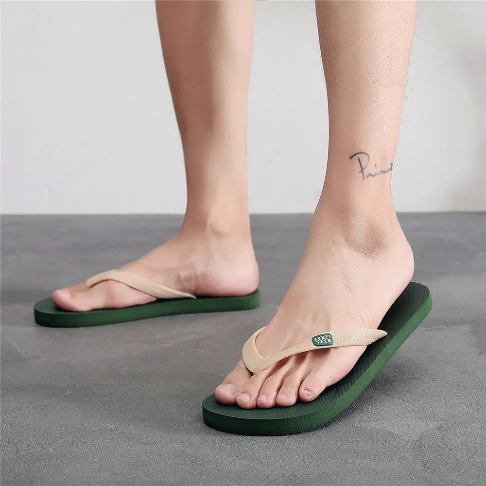 Men's black rubber flip-flop slipper with EVA upper and non-slip sole.