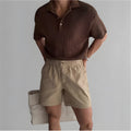 Men's loose cotton sports shorts in black colour showing athletic design for summer wear