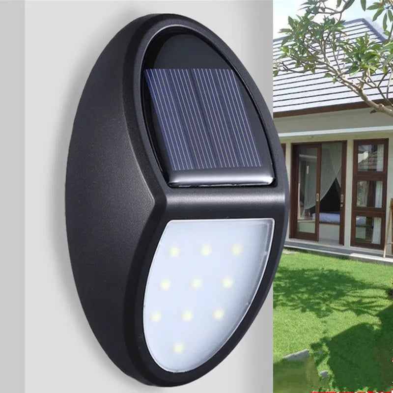 Black compact square solar-powered LED wall light for outdoor use.