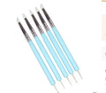 Five double-ended nail art and sculpture tools with silicone tips and wooden handles in light blue, light green, and pink
