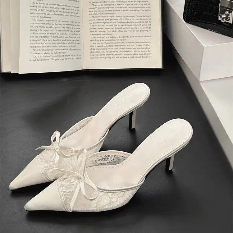 Women's apricot high heels with lace and bowknot detail on a pointed toe.