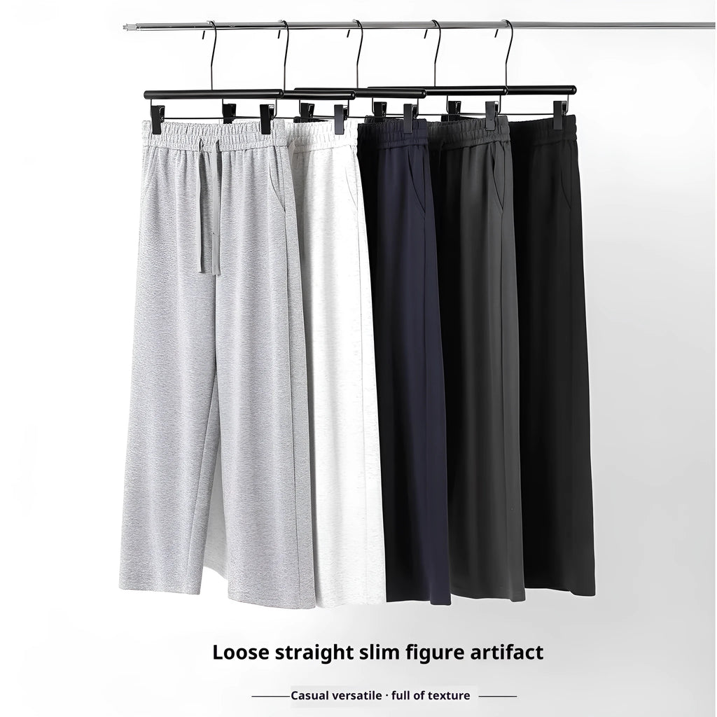 High-waisted straight-leg cotton trousers in loose fit, shown in available colours, sizes M to 3XL