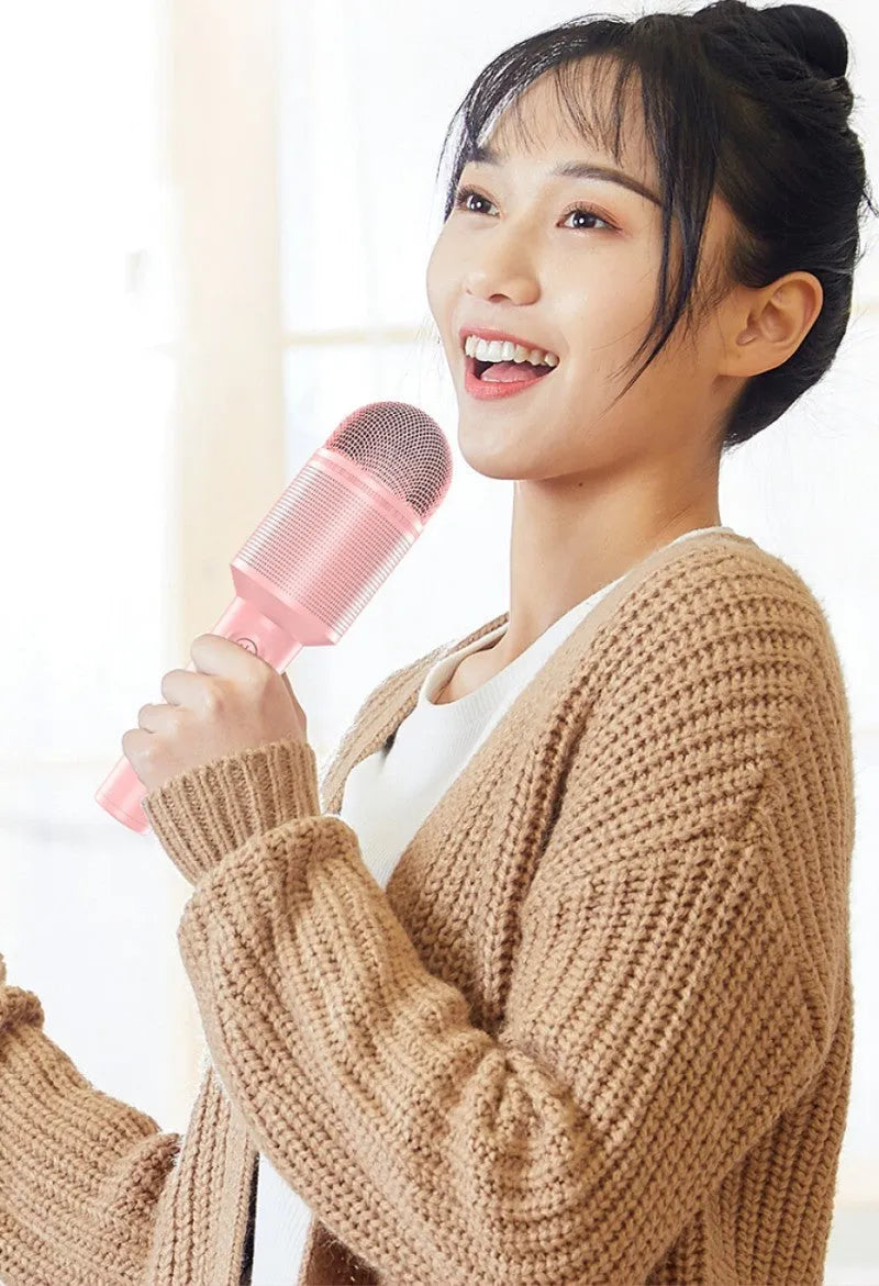 Bluetooth wireless karaoke microphone in pink, blue or green with built-in speaker and USB port