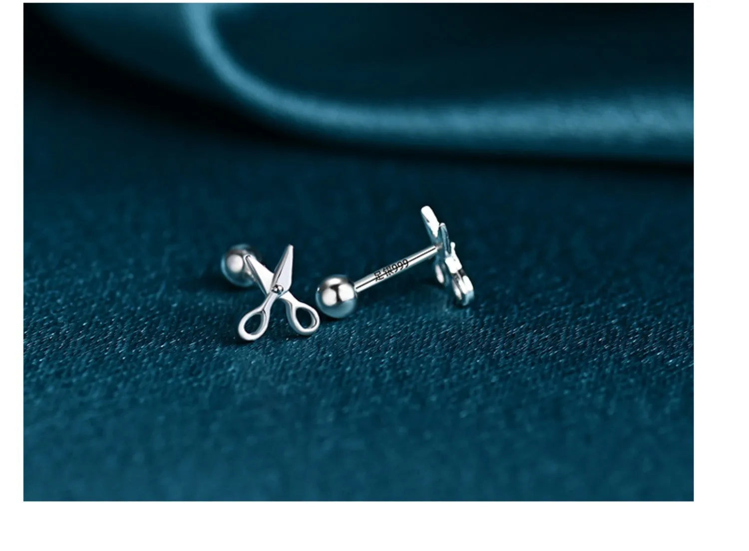 A pair of S999 pure silver ear nail earrings with a mini scissors and screws design.