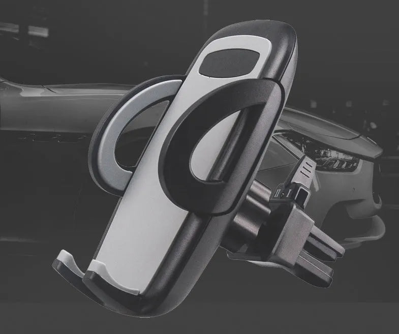Black plastic universal car phone holder mounted on a car air vent