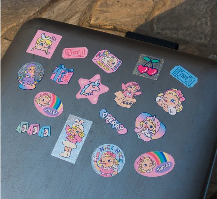 Pack of 16 cute cartoon girl and heart PVC stickers in a square storage box for DIY decoration.