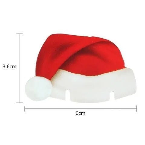 Set of 10 red non-woven fabric Santa hat decorations for wine glasses on a party table