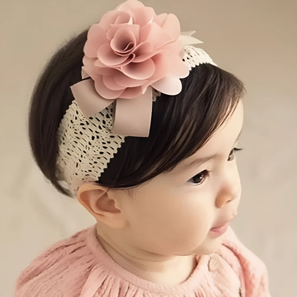 Baby lace headband with fabric flower in grey on a white background