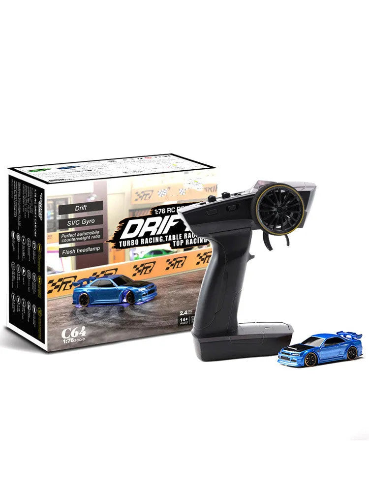 Turbo Racing C64 blue RC drift car with proportional remote control on racing track