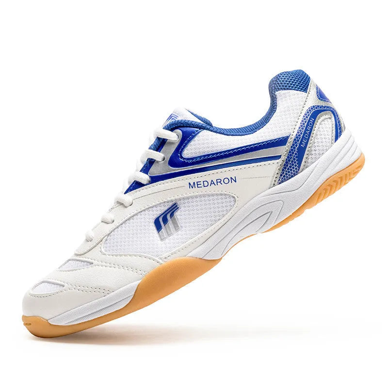 White and blue table tennis sneakers with lace-up front, round toe, and rubber sole.