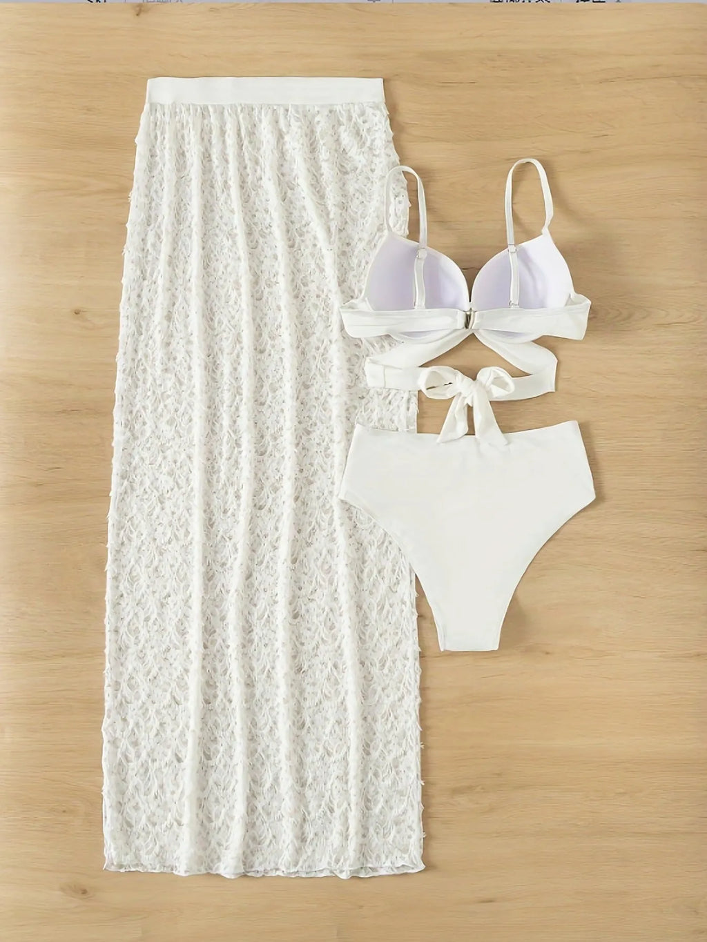 White nylon three-piece swimsuit set with bikini top, briefs, and a long gathered skirt.