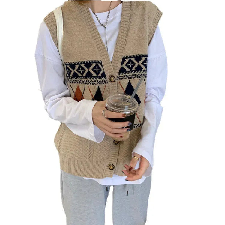 Khaki diamond plaid sleeveless loose cardigan top on a hanger.