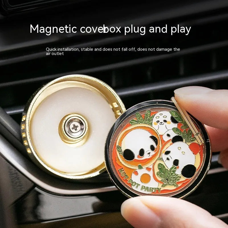 Panda-shaped car air freshener diffuser with changeable fragrance tablets for vehicle odour removal.